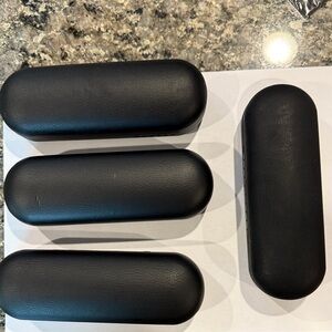 Four used Oakley Black Glasses Cases